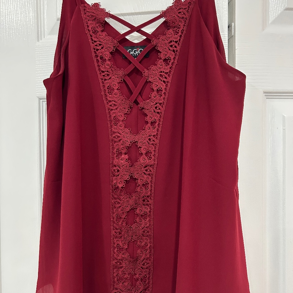 Gigio size medium burgundy color shirt.